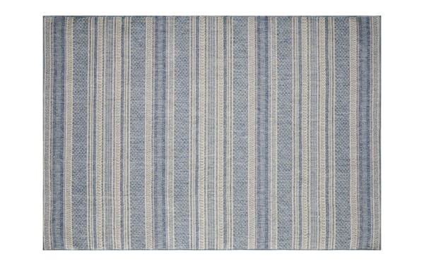 Blue and beige striped woven area rug with textured vertical lines, suitable for living room or bedroom flooring, featuring a casual, coastal style.