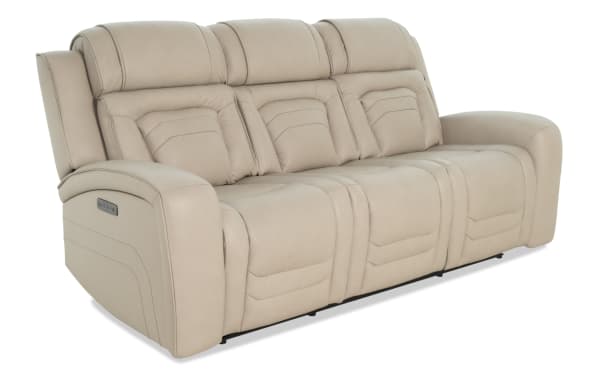Beige leather reclining sofa with plush padded cushions, three seats, and wide armrests, designed for comfort and modern living rooms.