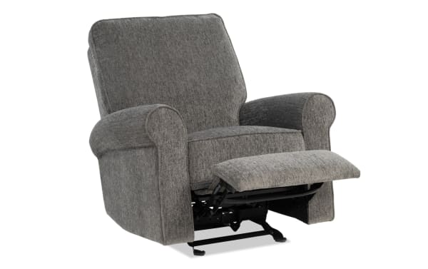 Gray fabric upholstered recliner chair with padded armrests and backrest, featuring a partially extended footrest and metal reclining mechanism.