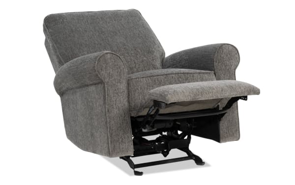 Gray fabric upholstered recliner chair with padded armrests and cushioned backrest, featuring a metal reclining mechanism and footrest extended.