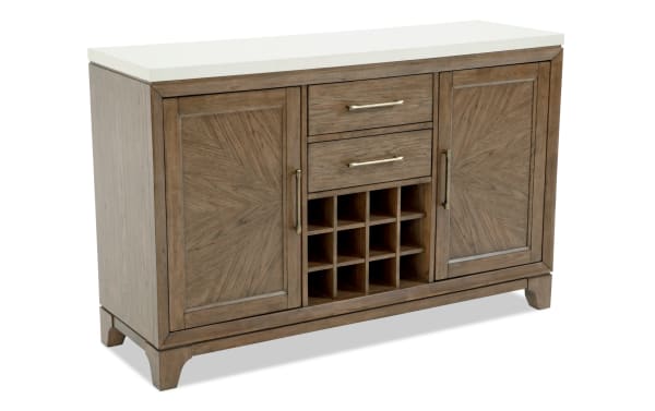 Wooden sideboard with a white marble top, featuring two paneled doors, two drawers with brass handles, and a central wine rack with nine compartments.