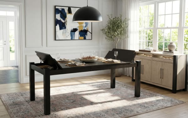 Aurora Brown & Black Counter Height Extendable Storage Dining Table from Aurora Dining collection, transitional style with MDF and rubberwood solids, featuring a dark brown extendable top with built-in storage compartments and sturdy black legs, perfect for meals, homework, or games in a bright dining room.