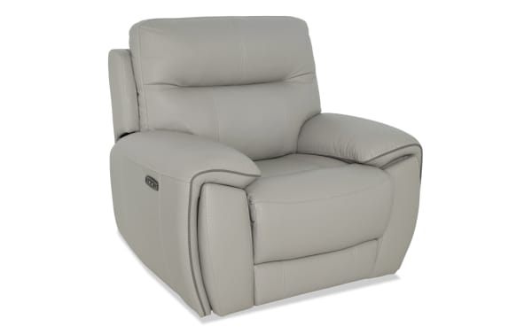 Gray leather recliner chair with padded armrests and cushioned backrest, featuring a side control panel for reclining adjustments.