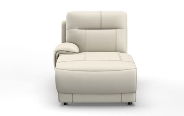 Modern beige leather chaise lounge with detailed stitching, cushioned armrest, and low black legs, designed for stylish comfort.
