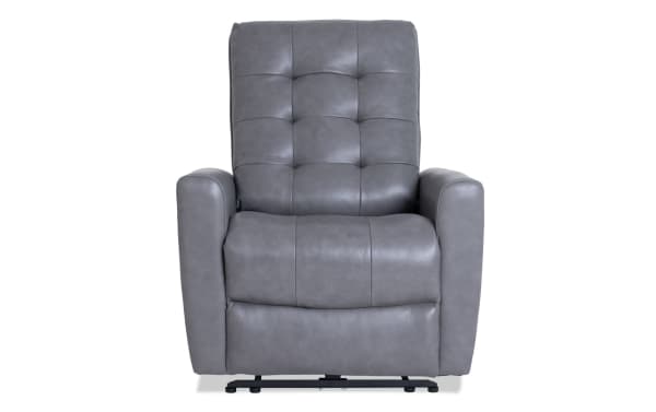 Gray leather recliner chair with tufted backrest, padded armrests, and cushioned seat, designed for comfort and relaxation.