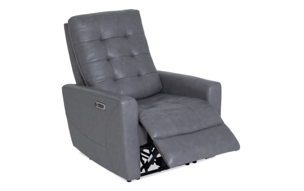 Gray leather recliner chair with tufted backrest and padded armrests, featuring a side control panel for reclining adjustment.