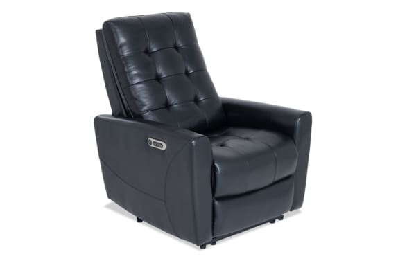 Black leather power recliner chair with tufted cushioning, padded armrests, and side control panel for adjustable comfort.
