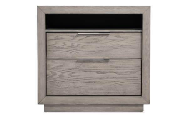 Gray wooden nightstand with two drawers and metal handles, featuring a modern frame design and an open shelf for storage.