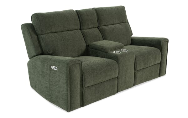 Dark green fabric reclining loveseat with center console, cup holders, and padded armrests, designed for living room comfort.
