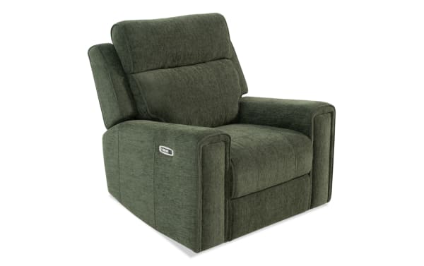 Green fabric upholstered power recliner chair with padded armrests and adjustable backrest, featuring a side control panel for reclining functions.