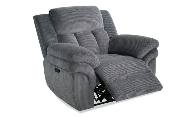 Gray fabric recliner chair with textured upholstery, padded armrests, and cushioned backrest, designed for comfort and relaxation.