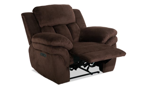 Brown plush fabric recliner chair with padded armrests and cushioned backrest, featuring an extended footrest for added comfort.