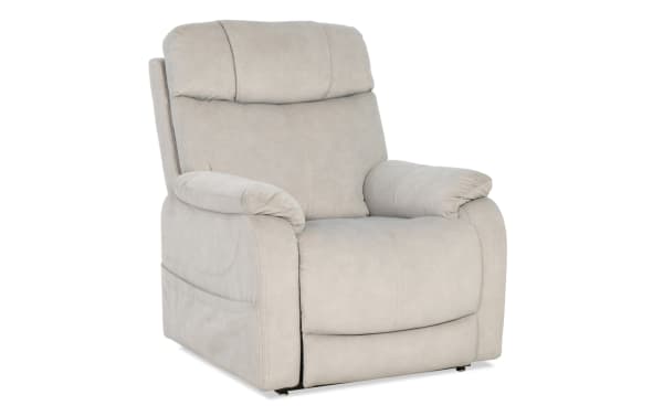 Light gray upholstered recliner chair with padded armrests and cushioned backrest, featuring soft microfiber fabric and contemporary design.