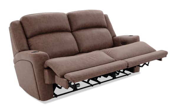 Brown leather reclining sofa with padded armrests, cup holders, and extended footrest, designed for comfort and relaxation.
