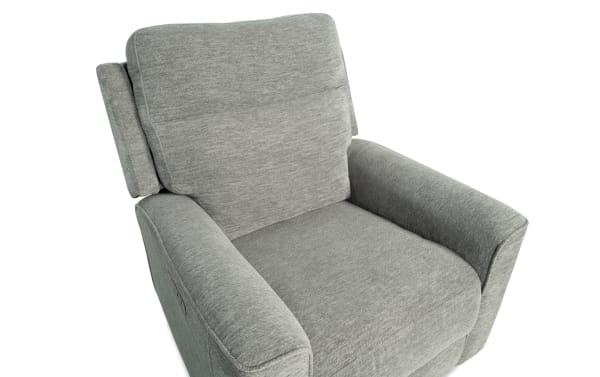 Gray fabric upholstered recliner chair with cushioned backrest and armrests, designed for comfort and relaxation in living spaces.