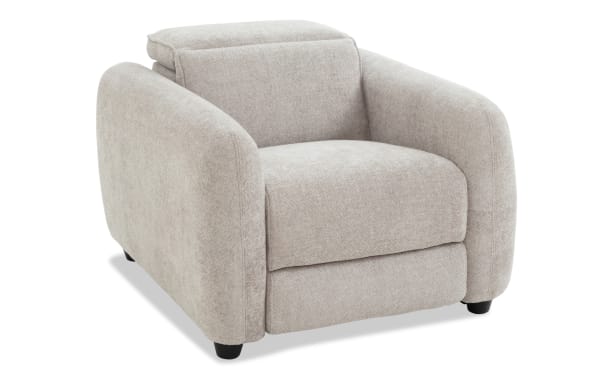 Beige fabric upholstered armchair with rounded armrests, cushioned seat and backrest, and black tapered legs, suitable for modern living rooms.
