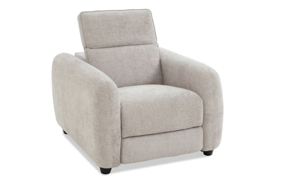Beige fabric upholstered armchair with plush cushioning, rounded armrests, and a modern, cozy design suitable for living room seating.