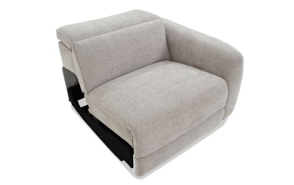 Modern light gray fabric upholstered single-seat sectional sofa corner piece with plush cushioning and curved armrest, ideal for living room seating.