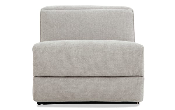 Modern beige fabric upholstered armless accent chair with cushioned seat and backrest, featuring a clean, minimalist design.
