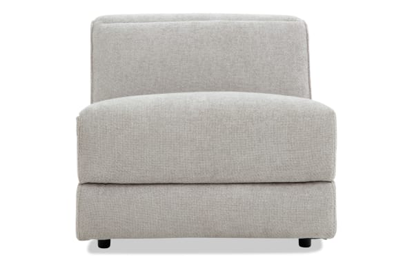 Modern armless accent chair upholstered in light gray textured fabric with a low backrest and cushioned seat, ideal for living room seating.