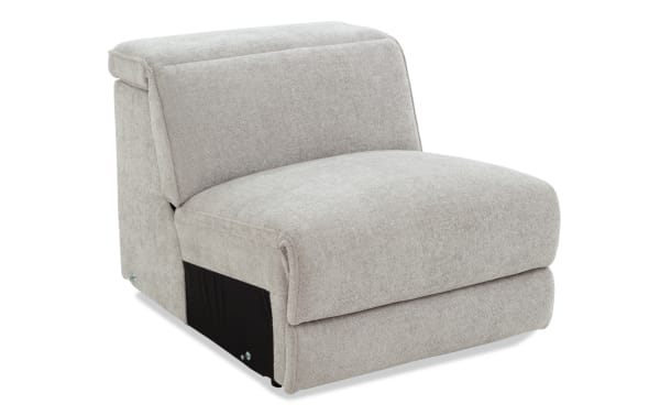 Light gray fabric armless modular sofa chair with plush cushioning and modern, minimalist design for living room seating.