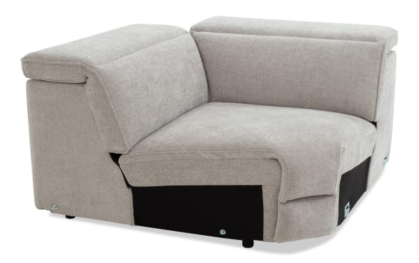Light gray fabric corner sofa section with cushioned backrests and armrests, featuring a modern, modular design and sturdy construction.