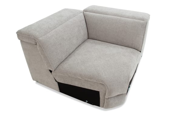 Light gray fabric corner sofa section with cushioned backrest and armrest, featuring a modern, minimalist design suitable for living room seating.