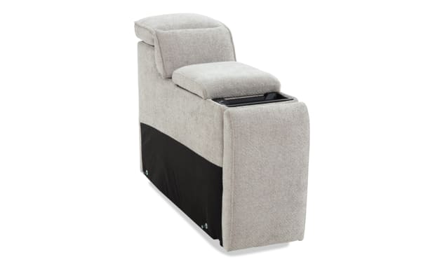Light gray fabric sofa armrest console with cushioned top and built-in storage compartment, featuring a black fabric panel on the side.
