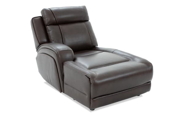 Dark brown leather recliner chaise lounge with padded armrest and cushioned backrest, designed for comfortable seating and relaxation.
