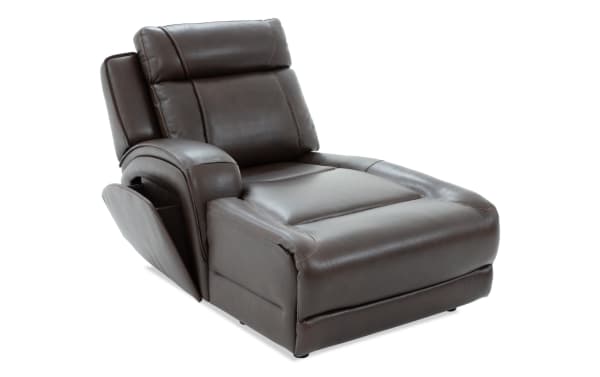 Dark brown leather recliner chaise lounge with padded armrest, cushioned backrest, and side storage pocket, designed for comfort and relaxation.