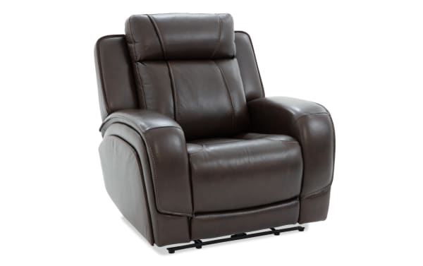Dark brown leather recliner chair with padded armrests, cushioned backrest, and visible stitching, designed for comfort and relaxation.