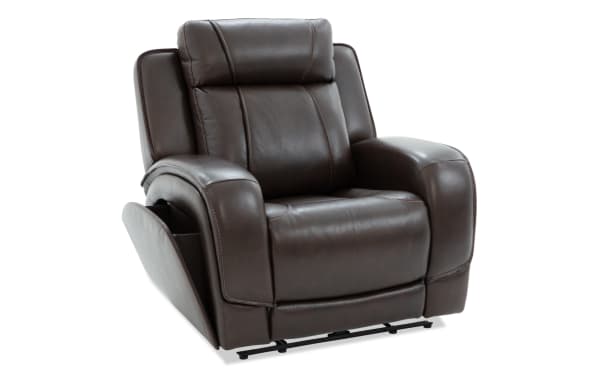 Dark brown leather recliner chair with plush cushioning, wide armrests, and visible stitching, designed for comfort and relaxation.