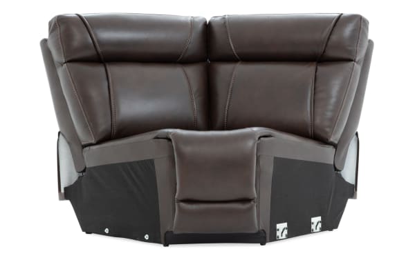 Dark brown leather reclining loveseat with padded headrests, contrast stitching, and black fabric base, designed for comfort and durability.