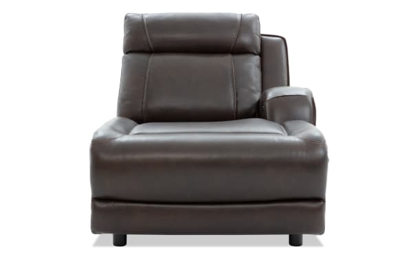 Dark brown leather recliner chair with padded armrests and cushioned backrest, featuring detailed stitching and modern design.