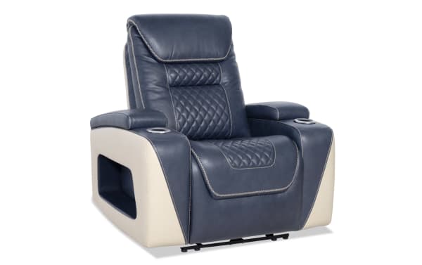 Blue and beige leather recliner chair with quilted stitching, padded armrests with cup holders, and modern design for home theater seating.