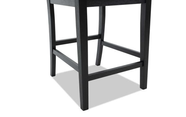 Black wooden chair legs with horizontal support bars, showcasing sturdy construction and modern design, ideal for dining or office seating.