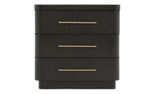 Dark wood three-drawer nightstand with rounded edges and sleek gold metal handles, suitable for modern bedroom storage.