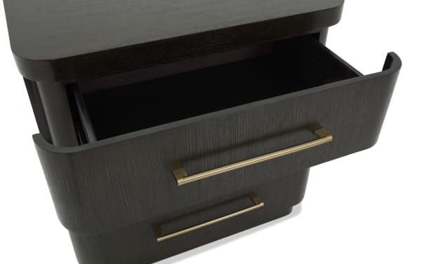 Dark wood drawer with a gold metal handle, partially open, showcasing smooth finish and modern furniture design.