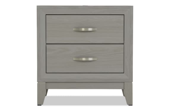 Gray wooden two-drawer nightstand with silver curved handles, modern design, and tapered legs, suitable for bedroom storage.