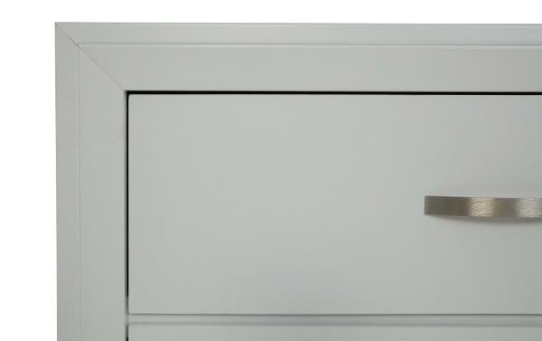 Close-up of a light gray metal cabinet drawer with a brushed stainless steel handle, showcasing clean lines and modern design.