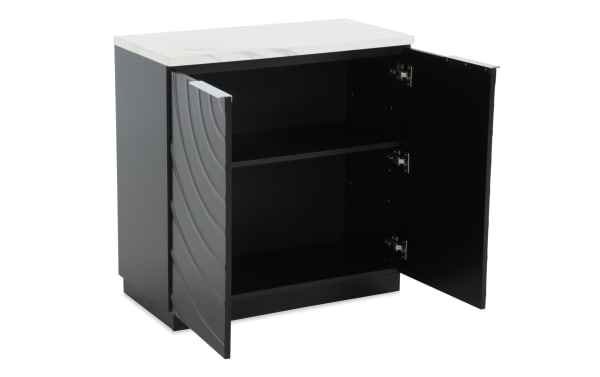 Modern black storage cabinet with two open doors, featuring a white marble top, interior shelf, and wave-textured door design for stylish organization.