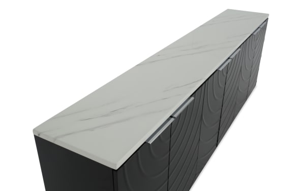 Modern black sideboard with textured front panels and sleek silver handles, topped with a white marble surface, ideal for stylish storage.