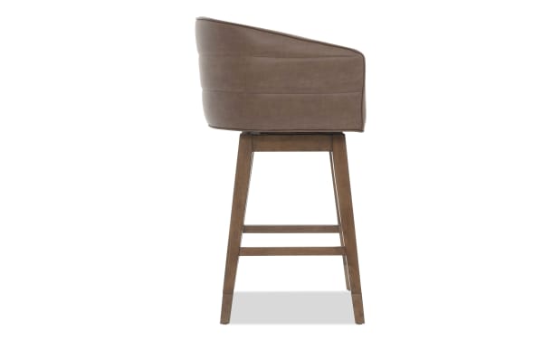 Brown leather swivel bar stool with wooden legs, padded armrests, and mid-century modern design for kitchen or home bar seating.