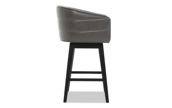 Gray leather upholstered bar stool with black wooden legs, featuring a cushioned seat and backrest with horizontal stitching detail.