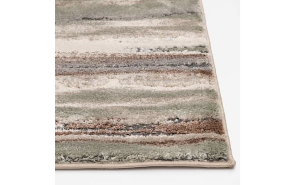 Oakley 5' x 7' multicolored striped transitional rug with thick polyester pile, featuring earthy tones and soft texture for comfortable flooring.