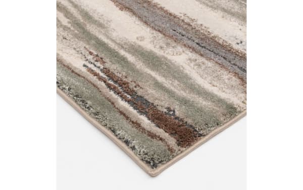 Oakley 5' x 7' multicolored striped transitional rug with thick polyester pile, featuring earthy tones and soft texture for comfortable flooring.