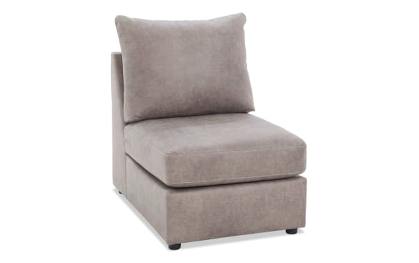 Armless accent chair with taupe microfiber upholstery, thick seat cushion, and plush back pillow, ideal for modern living rooms.