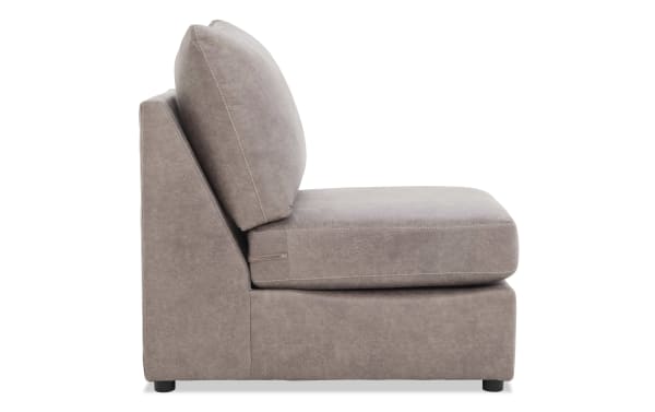 Armless taupe microfiber upholstered chair with thick cushioned seat and backrest, modern minimalist design for living room seating.