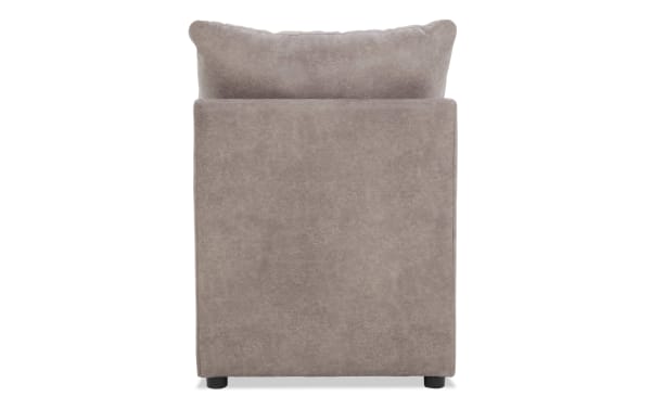 Upholstered taupe fabric armchair with a cushioned backrest and black cylindrical legs, showcasing a modern, minimalist design.