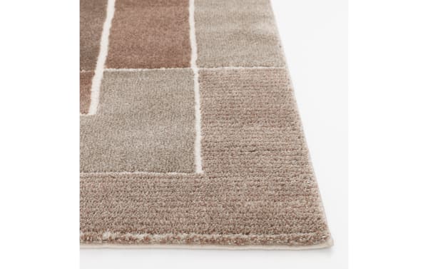 Atlas 5' x 7' Rust Geometric Rug with bold rust and orange geometric pattern, thick soft polypropylene pile, transitional style for cozy living spaces.
